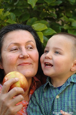 Photo of grandmother with grandson feeding healthy diet