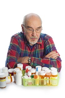 picture of senior with many prescription drugs