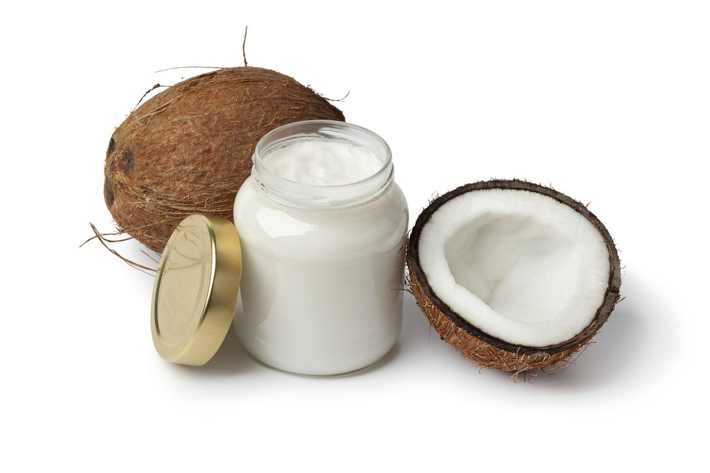 Coconut oil and fresh coconut on white background